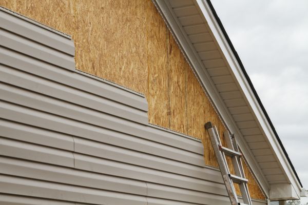 Grey Vinyl Siding Installation in Longmont
